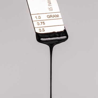 Lifecykel Shilajit syrup in a metal measurement.